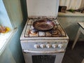 Very dirty and old gas stove and frying pan on the kitchen Royalty Free Stock Photo