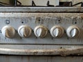 Very dirty and old gas stove knobs Royalty Free Stock Photo