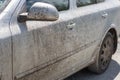 Very dirty white passenger car close up Royalty Free Stock Photo