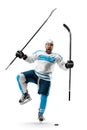 Very emotional hockey player with sticks in his hands. Sports emotions. Athlete in action. Hockey athlete with desire to Royalty Free Stock Photo