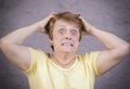Very emotional woman on a gray background Royalty Free Stock Photo