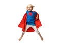 Very excited little girl dressed like superhero jumping isolated on white background.