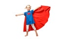 Very excited little girl dressed like superhero jumping isolated on white background.