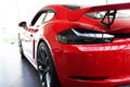 Very fast red sports car from behind Royalty Free Stock Photo