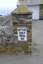 Very forceful  parking sign, on a stone pillar, Cornwall, UK Royalty Free Stock Photo