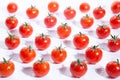 Very fresch tomatoes in symmetrical composition on white background