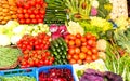 very fresh fruit and vegetables for sale in the market stall with courgettes tomatoes Royalty Free Stock Photo