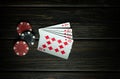 A very gambling game of poker with a winning combination of a royal flush. Cards with chips on a dark vintage table in a poker Royalty Free Stock Photo