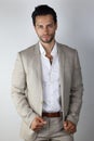 very good looking man wears a beige suit Royalty Free Stock Photo