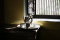 Very Good Morning Tea set with shining silver utensils, Morning sunrise light coming through window is shining on the silverware