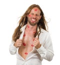 Very happy hippie man covered in red kisses
