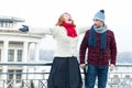 Screaming red hair woman and guy looking to her. Very happy woman crying on the bridge and surprised man.