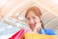 Very happy young woman with shopping bags, at centre or mall. Sales, shop, retail, consumer concept. Copyspace area for text or Royalty Free Stock Photo