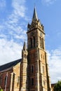 Very high belltower of cathedral in Dambach la Ville, France Royalty Free Stock Photo