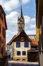 Very high belltower of cathedral in Dambach la Ville, France Royalty Free Stock Photo