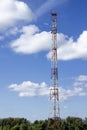 Very high cell tower on a background of blue sky Royalty Free Stock Photo
