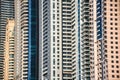 Very high skyscrapers close up of windows and balcony`s of crowded residential buildings