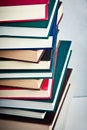 Very high stack of books on a table Royalty Free Stock Photo