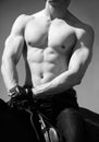 Very hot muscular torso of a male cowboy rider on horseback. Royalty Free Stock Photo