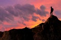 Very interesting moment. A young mountainer has managed to climb to the top and achieve his goal. Royalty Free Stock Photo