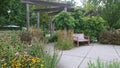 Empty bench in enabling garden in enabling garden, riverside park Guelph Ontario Canada conservation grandriver