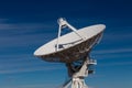 Very Large Array centered view of VLA radio antenna dish isolated against a deep blue sky Royalty Free Stock Photo