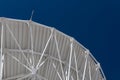 Very Large Array graceful arch of a large radio telescope dish against blue sky, science engineering Royalty Free Stock Photo