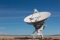 Very Large Array VLA radio antenna dish against a blue sky in the New Mexico desert, technology space exploration science Royalty Free Stock Photo