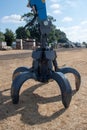 Very large industrial mechanical grabber on ground