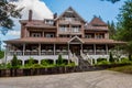 Very large log house in rustic style, three floors, attic and a porch, in beautiful location, surrounded by trees