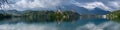 Very large panoramic view on The Church of Mary the Queen, located on an island in Lake Bled. Slovenia Royalty Free Stock Photo