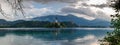 Very large panoramic view on The Church of Mary the Queen, located on an island in Lake Bled. Slovenia Royalty Free Stock Photo