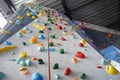 a very large rock climbing wall full of lots of different things Royalty Free Stock Photo