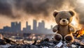 very little teddy bear toy over city burned destruction of an aftermath war conflict, earthquake or fire and smoke of world war