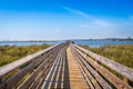 A very long boardwalk surrounded by shrubs in Gulf Shores, Alabama Royalty Free Stock Photo