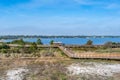 A very long boardwalk surrounded by shrubs in Gulf Shores, Alabama Royalty Free Stock Photo