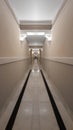 Very long corridor in a hotel with hidden lights Royalty Free Stock Photo