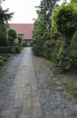 Very long stone footpath leading to an old church building