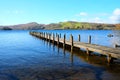 Very long symetrical beautiful wooden jetty, jutting out from th Royalty Free Stock Photo