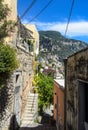 A very narrow street up a steep hill in Positano, Italy.