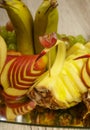 Very nice and artistically sliced fruits on a platter. Royalty Free Stock Photo
