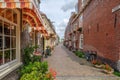 Very nice old alley with flowers in the old city center of Delft, the Netherlands