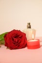 the very nice red rose perfume with a candle Royalty Free Stock Photo