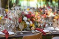 A very nicely decorated wedding table appointments with beautiful decor with plates and serviettes in spring garden Royalty Free Stock Photo