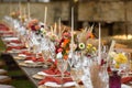 A very nicely decorated wedding table appointments with beautiful decor with plates and serviettes in spring garden Royalty Free Stock Photo