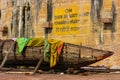 very old and abandoned boat with some dirty clothes on in Varanasi