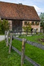 Very old abandoned farm house with wooden fence Royalty Free Stock Photo