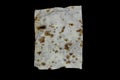 Very old and aged white paper sheet with brown spots on it isolated on black background surface Royalty Free Stock Photo