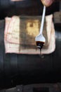 very old Balsamico dripping from a spoon
