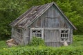 Very old barn with a ruined leaky roof Royalty Free Stock Photo